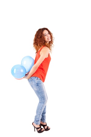 Happy beautiful woman holding balloons over white backgroundの写真素材