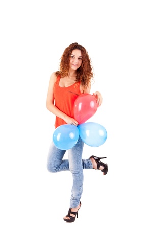 Happy beautiful woman holding balloons over white backgroundの写真素材