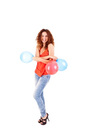 Happy beautiful woman holding balloons over white backgroundの写真素材
