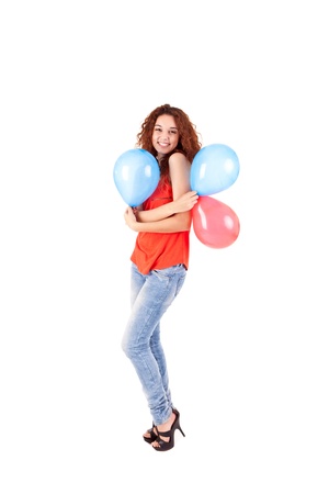 Happy beautiful woman holding balloons over white backgroundの写真素材