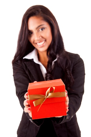 Beautiful mix race woman holding a gift over white backgroundの写真素材