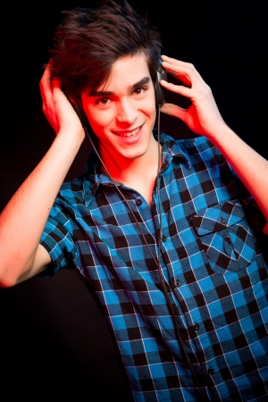 Young and handsome dj with headphones - Disco light effectの写真素材