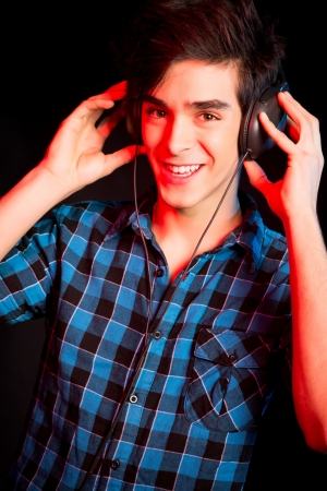 Young and handsome dj with headphones - Disco light effectの写真素材