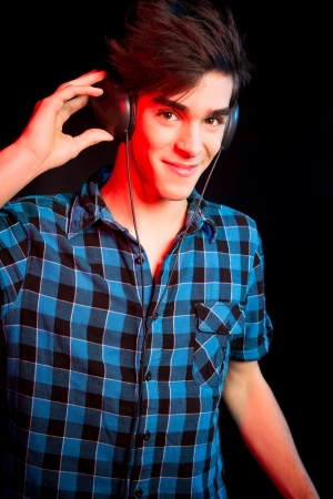 Young and handsome dj with headphones - Disco light effectの写真素材