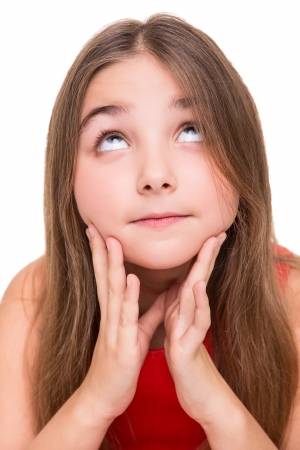 Portrait of a dreaming beautiful little girlの写真素材