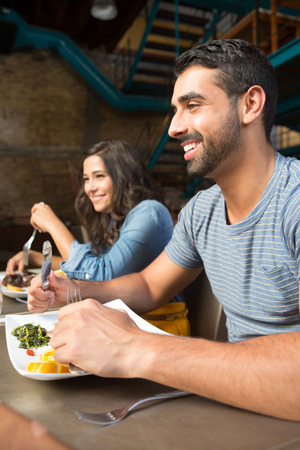 Couple having lunch at rustic gourmet restaurantの写真素材