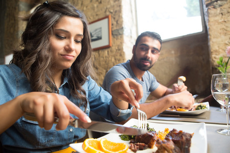 Couple having lunch at rustic gourmet restaurantの写真素材