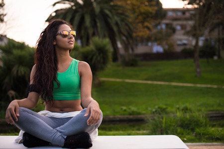 Fitness runner woman relaxing in the city parkの写真素材