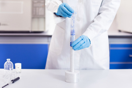 Chemical scientist working in modern biological laboratory