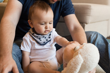 Modern father playing with little baby boyの写真素材