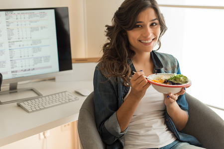 Young woman doing plans for her weekly dietの写真素材