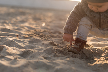 Toddler exploring the nature - Sunset Lightの写真素材
