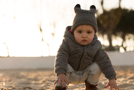 Toddler exploring the nature - Sunset Lightの写真素材