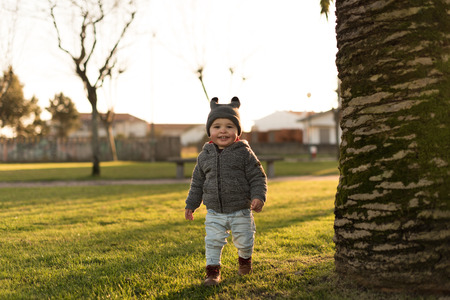 Toddler exploring the nature - Sunset Lightの写真素材