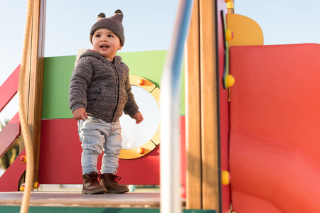 Little boy having fun on a toddler parkの写真素材