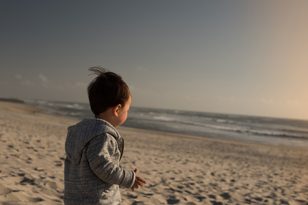 Toddler having great fun on the beach