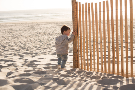Toddler having great fun on the beachの写真素材