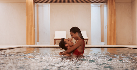 Couple in love at luxury Hotel Spa and poolの写真素材