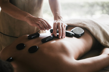 Man enjoying a relaxing back massage in Spa