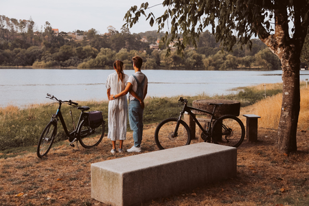 Young couple having a romantic date with bicyclesの写真素材