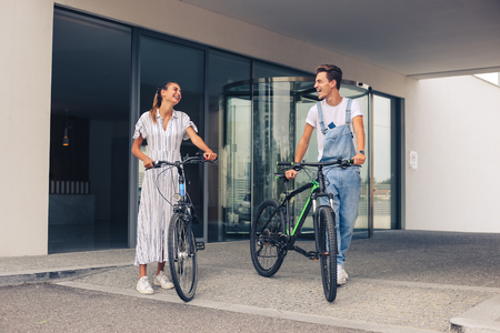 Young couple having a romantic date with bicyclesの写真素材