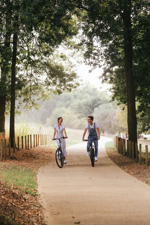 Young couple having a romantic date with bicyclesの写真素材
