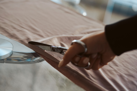 Tailor woman hands working on fabric - Tailoringの写真素材