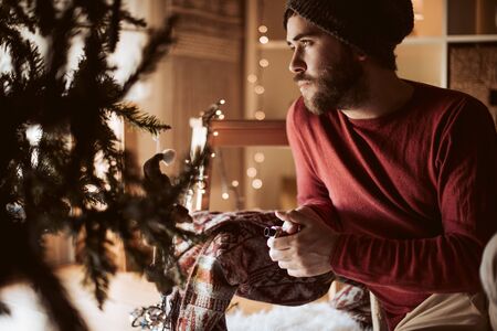 Trendy man using a vaper - Christmas and Winter Seasonの写真素材