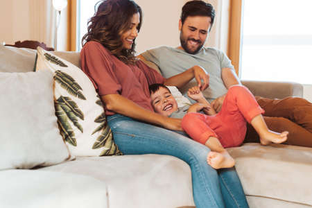 Young family having fun at homeの写真素材