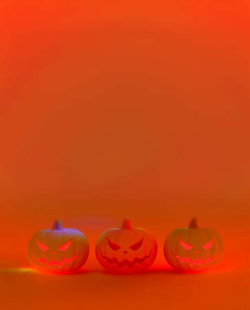 3D rendering painting style illustration three of Jack o lantern the pumpkin with evil face for halloween on fluorescent red orange light with blank space template backgroundの写真素材