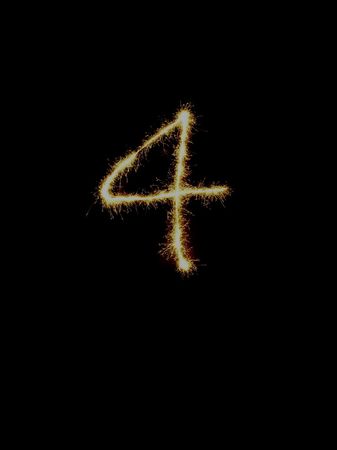 A sparkler traces the number の写真素材