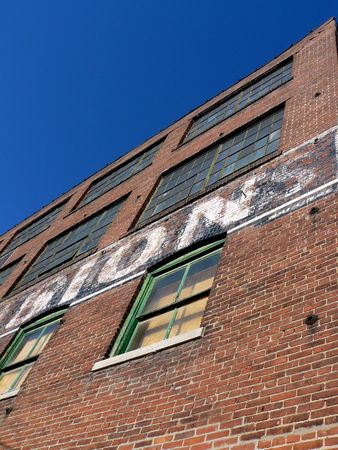 Detail of Faded Painted Advertising on Abandoned Buildingの写真素材