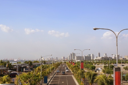 cityscape view from above in front of a vanishing road 