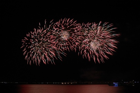 colorful huge fireworks display and reflection.