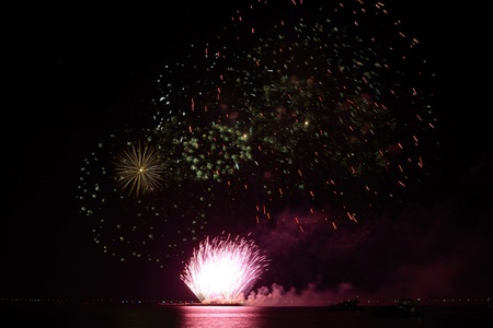 colorful huge fireworks display and reflection.の写真素材
