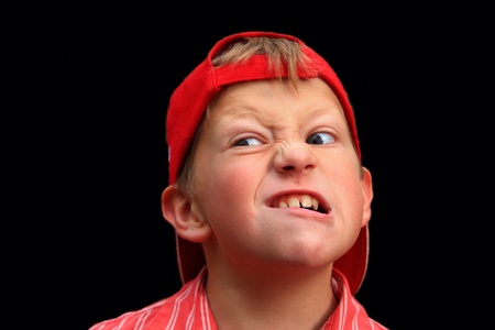 Boy showing disgusted faceの素材