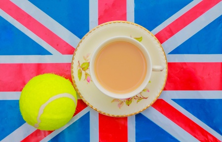 British Tennis - a cup of tea and a tennis ball on a Union Jack flagの素材