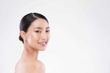 Side view of Beautiful Asian woman smile with clean and fresh skin Happiness and cheerful with positive emotional,isolated on white background,Beauty and Cosmetics Conceptの写真素材