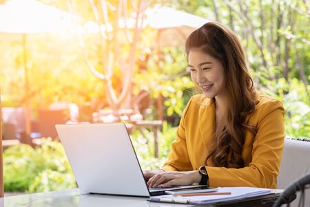 Business Asian young woman working with computer laptop and thinking to get ideas and requirement in Business startup feeling so happiness,Small Business Startup Conceptの写真素材