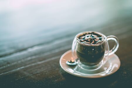 Hot Chocolate in cup on wooden table so sweet and warm drinking,Vintage tone,Selective Focusの写真素材