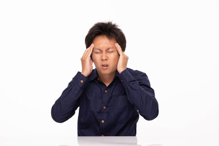 Asian man stress and headache Migraine isolated on white background,Health care Conceptの写真素材