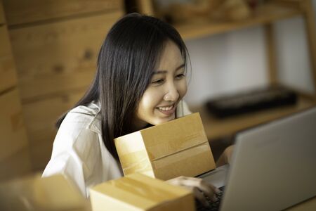 SME entrepreneur of Young Asian women working with laptop for Online shopping at home,Cheerful and...