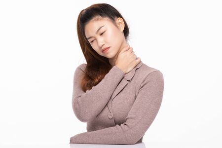 Asain Woman have a neck pain,Isolated on white background,office syndrome Conceptの写真素材