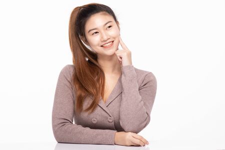 beautiful business Asian woman smile thinking to get ideas and business plan with happiness and confident feeling,Isolated on white,Positive emotional,Business Conceptの写真素材