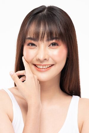 Young Beautiful Asian woman smile touching soft cheek with clean and fresh skin Happiness and cheerful with positive emotional,isolated on white background,Beauty Cosmetics and spa Treatment Conceptの写真素材