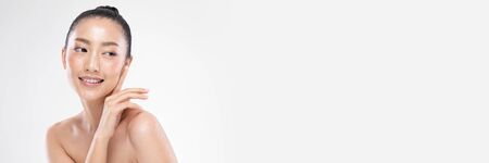 banner Beauty Asian woman touch cheek smile fresh facial treatmentの写真素材
