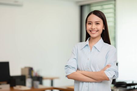 Asian business women leader standing smile cross arm and confidence at Co-Working space,Business Startup Concept の写真素材