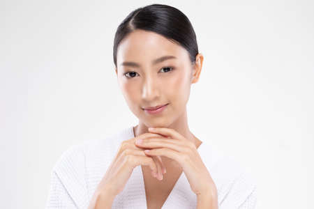 Beautiful Young Asian Woman Holding Hands smile feeling so happy and cheerful with healthy Clean and Fresh skin,isolated on white background,Beauty Cosmetics Conceptの写真素材