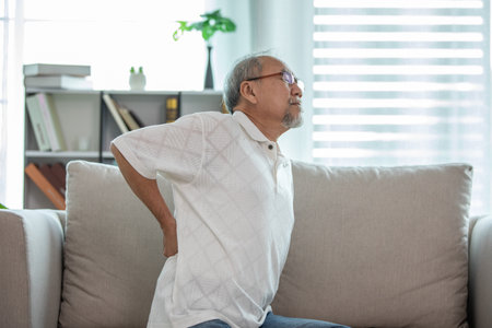 Asian Elderly senior man back pain and illnessの写真素材