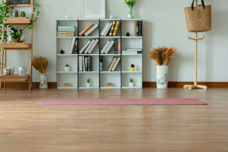 yoga mat in living room ready to excercise with yoga for wellness life